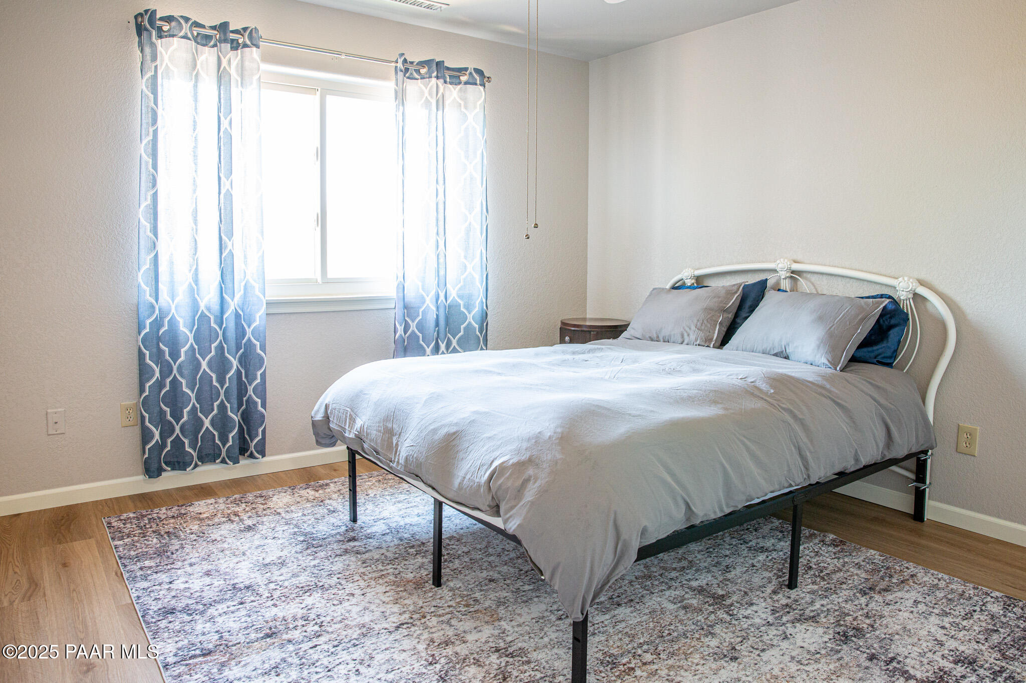 7075 Horizon Way Prescott Valley, AZ 86315 - Photo 12 of 44 a large bed sitting in a bedroom next to a window