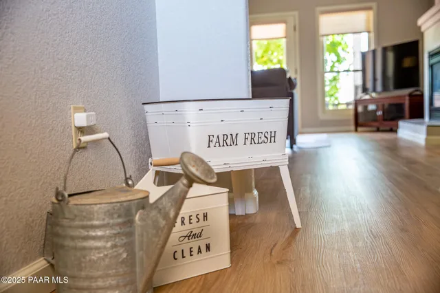 a view of a living room with furniture and a flat screen tv
