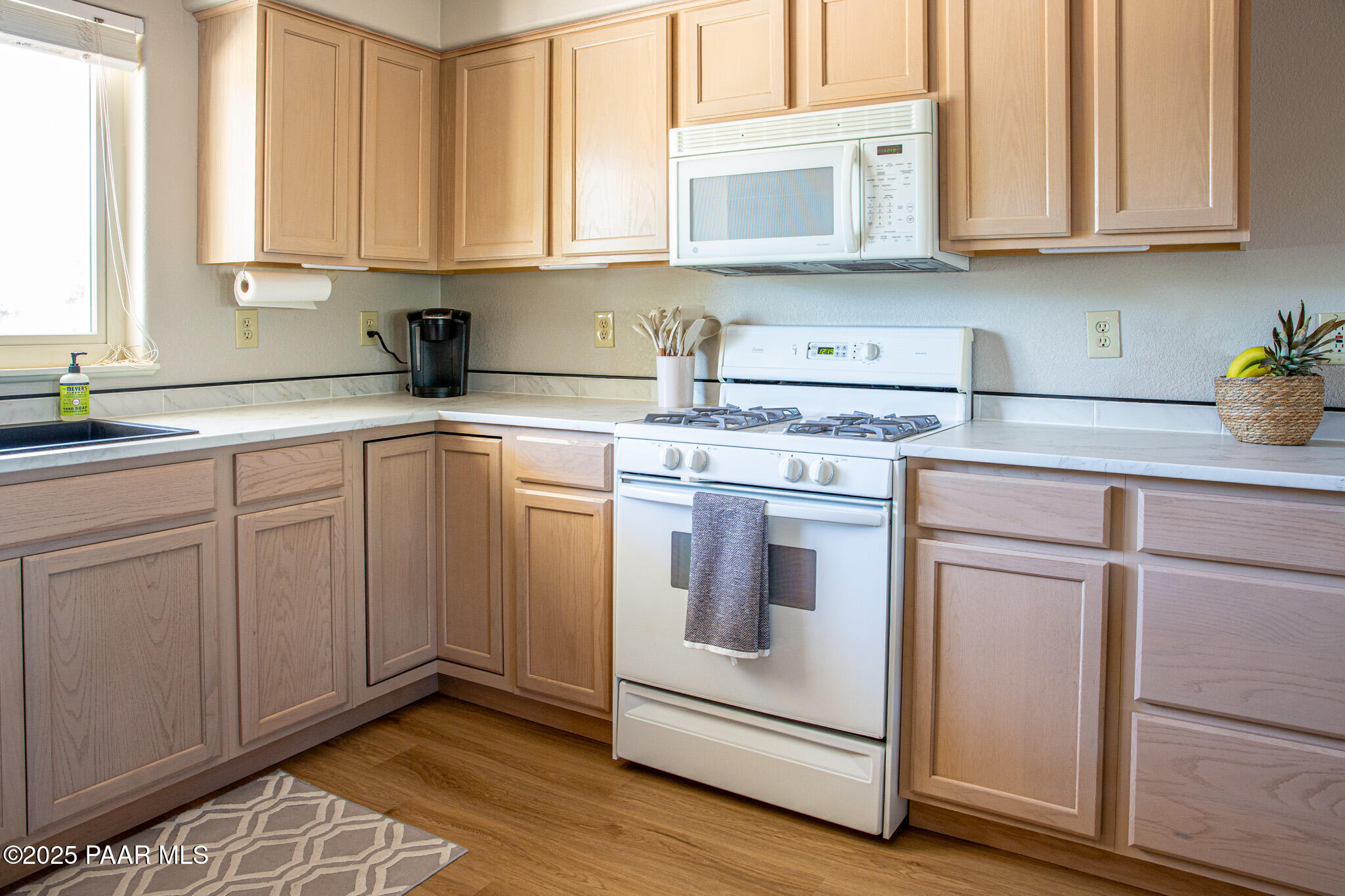7075 Horizon Way Prescott Valley, AZ 86315 - Photo 20 of 44 a kitchen with white cabinets and white appliances