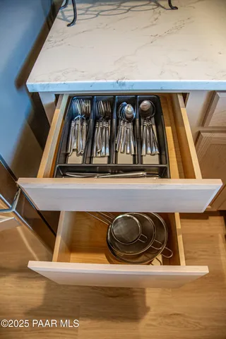 a kitchen with a refrigerator and a sink