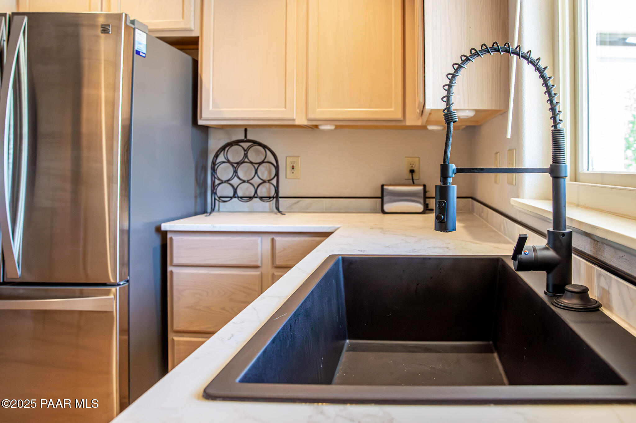 7075 Horizon Way Prescott Valley, AZ 86315 - Photo 25 of 44 a kitchen with a refrigerator and a sink