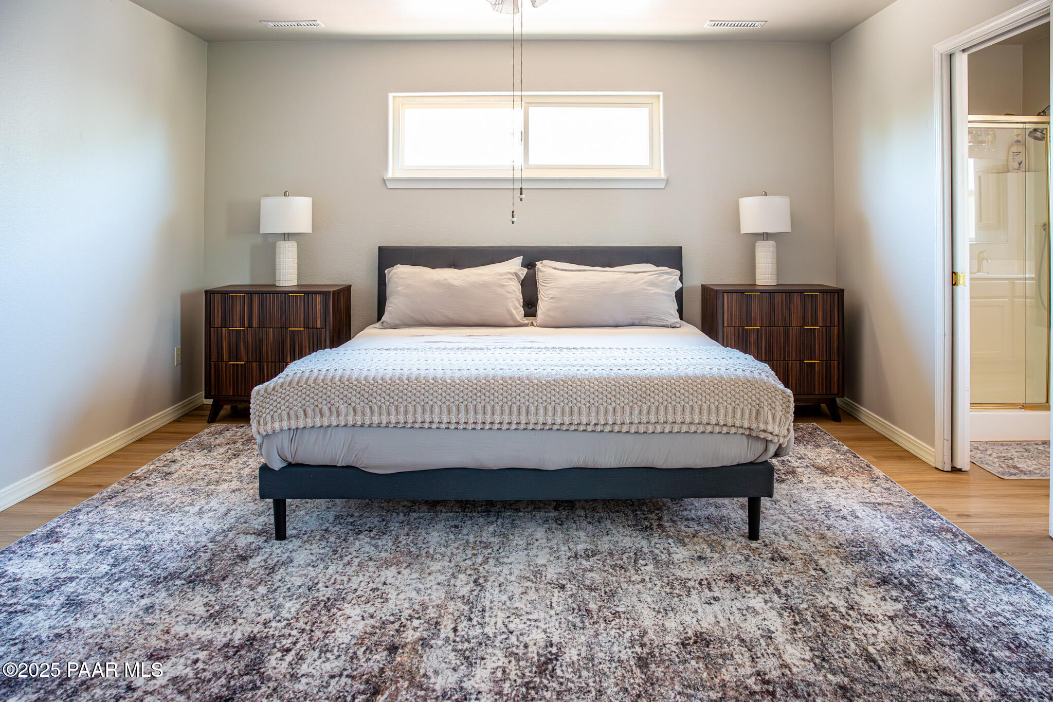 7075 Horizon Way Prescott Valley, AZ 86315 - Photo 26 of 44 a large bed sitting in a bedroom next to a window
