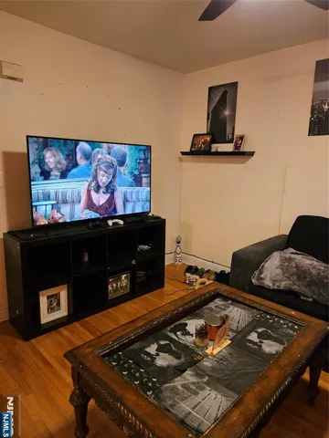 a room with furniture and flat screen tv