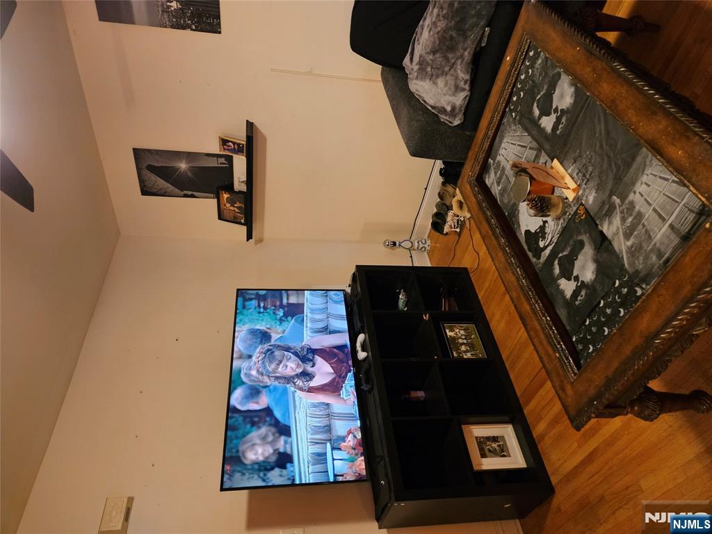 575 High Mountain Road, Unit 3 North Haledon, NJ 07508 - Photo 2 of 10 a room with furniture and flat screen tv