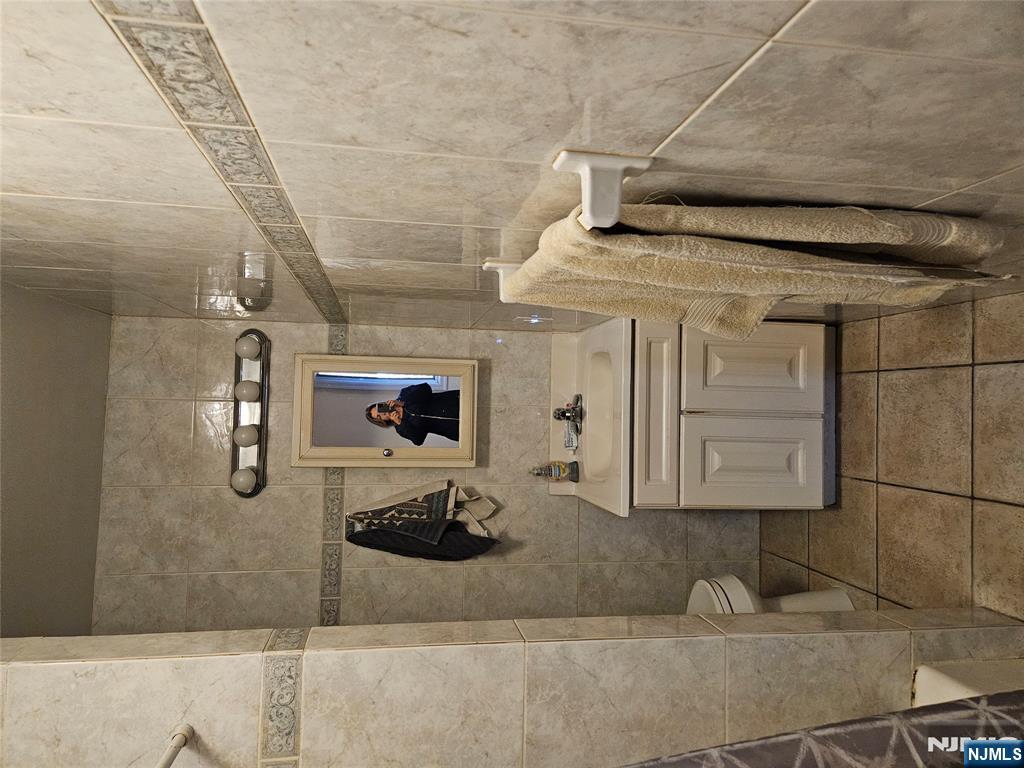 575 High Mountain Road, Unit 3 North Haledon, NJ 07508 - Photo 9 of 10 a bathroom with a sink and toilet