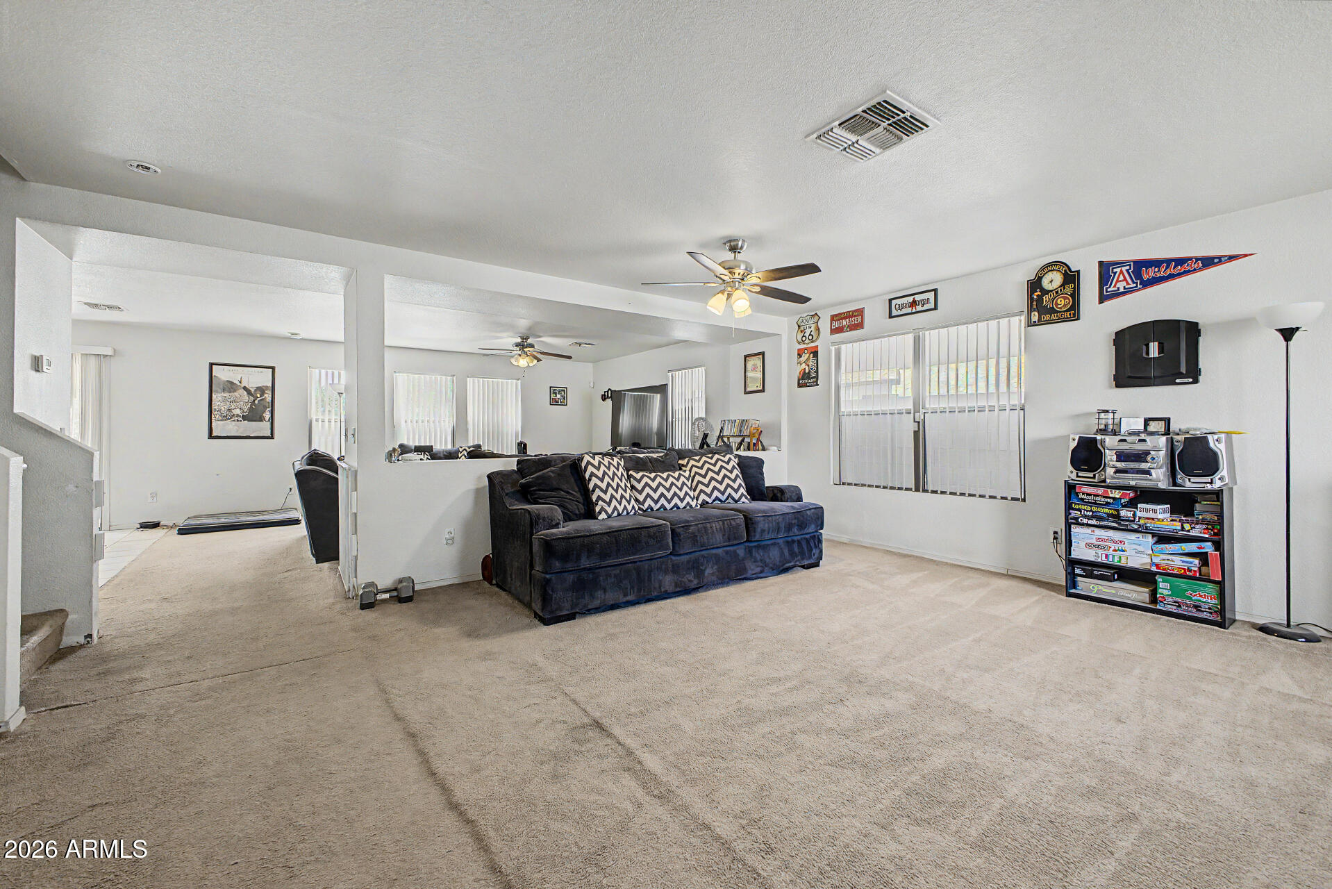2607 West Bloch Road Phoenix, AZ 85041 - Photo 5 of 34 a living room with furniture and a flat screen tv