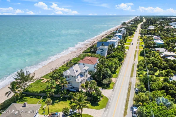 a swimming pool with outdoor seating and garden