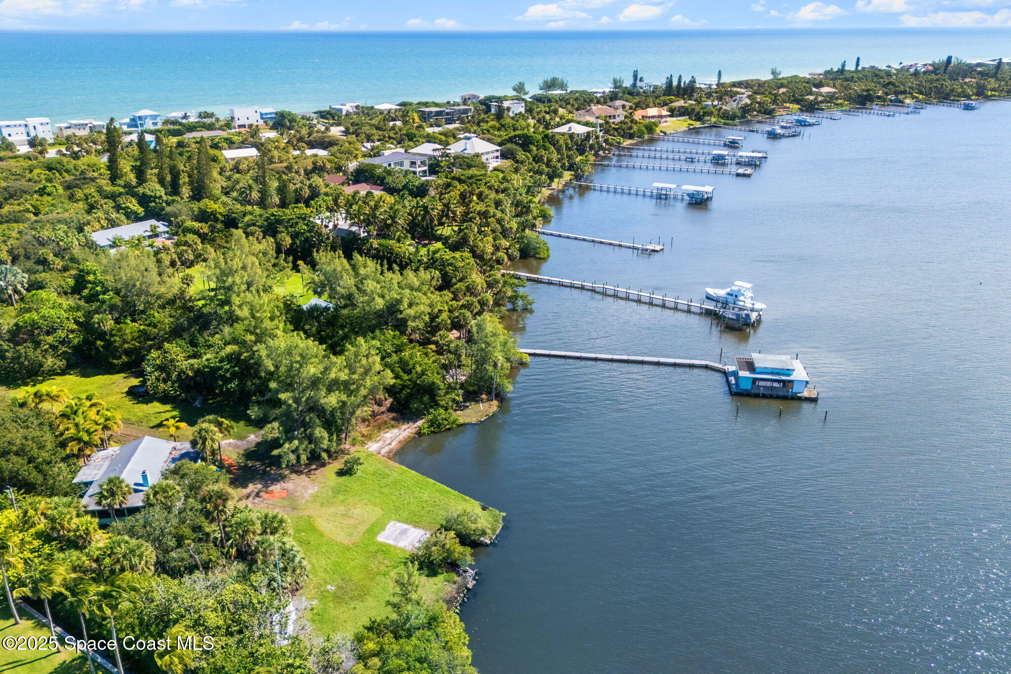 Tbd Tbd Winona Road Melbourne Beach, FL 32951 - Photo 17 of 25 an aerial view of a house with a yard and lake view