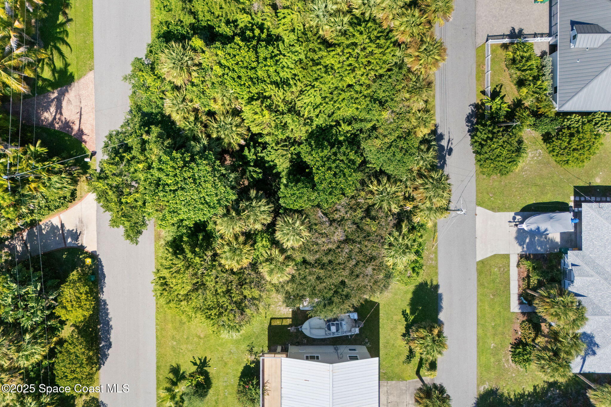 Tbd Tbd Winona Road Melbourne Beach, FL 32951 - Photo 19 of 25 an aerial view of a house with a yard
