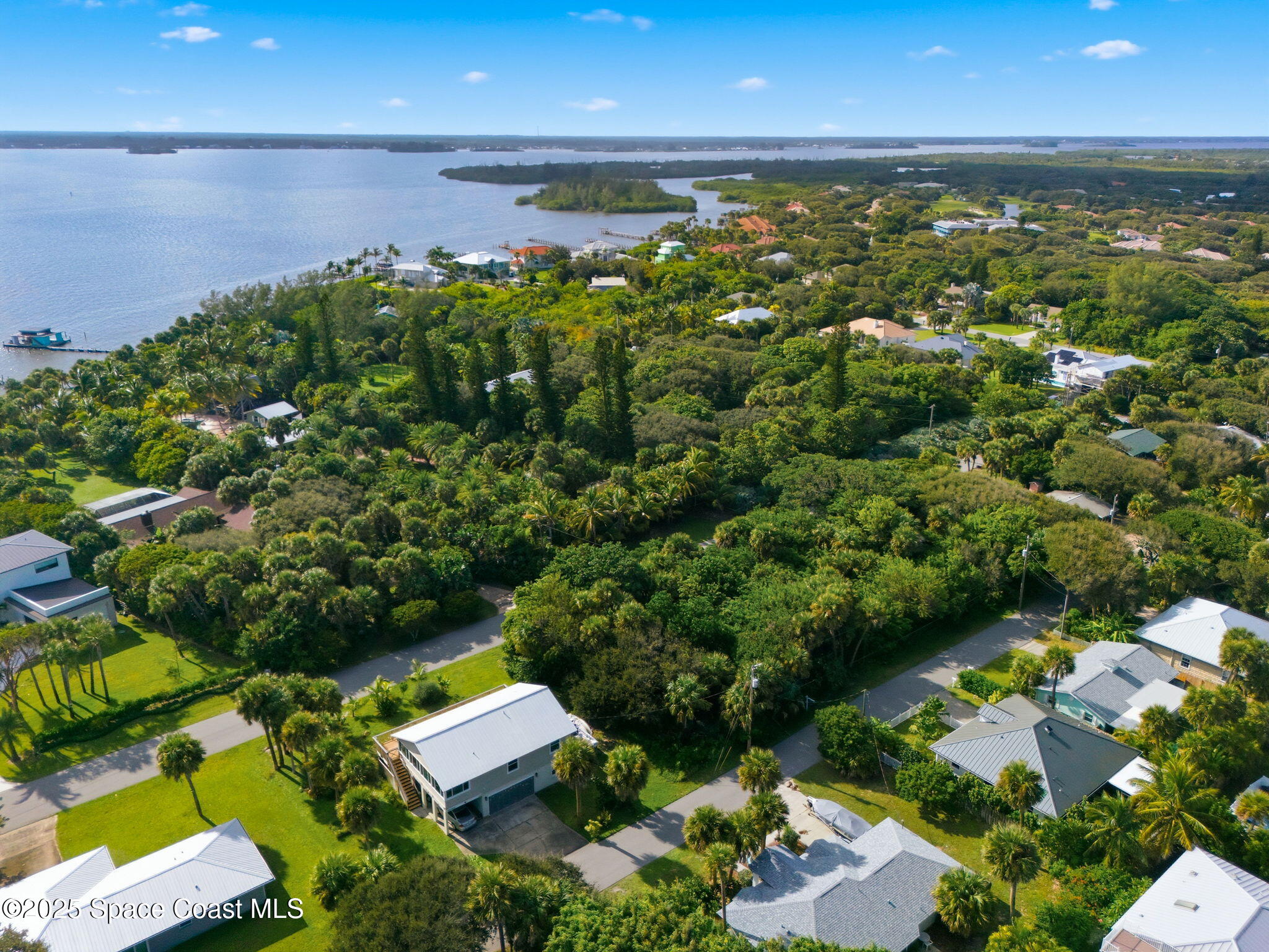 Tbd Tbd Winona Road Melbourne Beach, FL 32951 - Photo 8 of 25 an aerial view of a houses with a yard