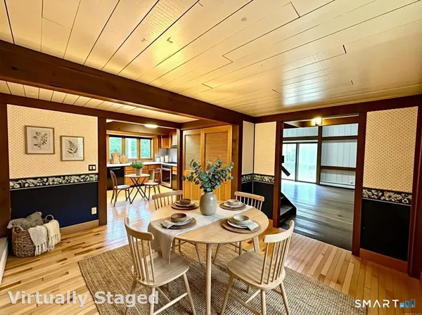 a bathroom with a granite countertop double vanity sink and a mirror