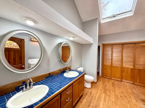 a view of an empty room with a fireplace and a window