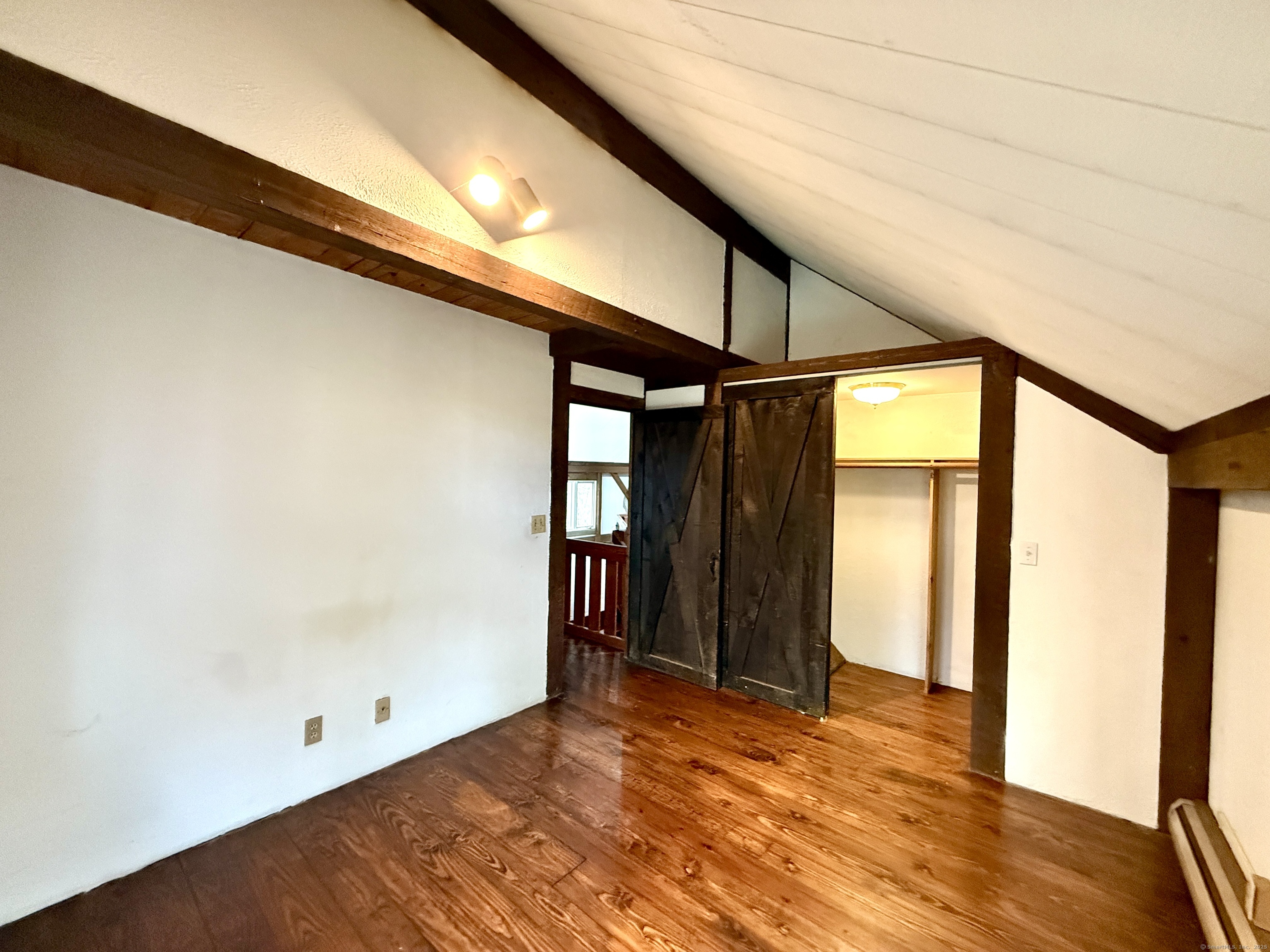 102 Krapf Road Ashford, CT 06278 - Photo 24 of 30 a view of an empty room with wooden floor
