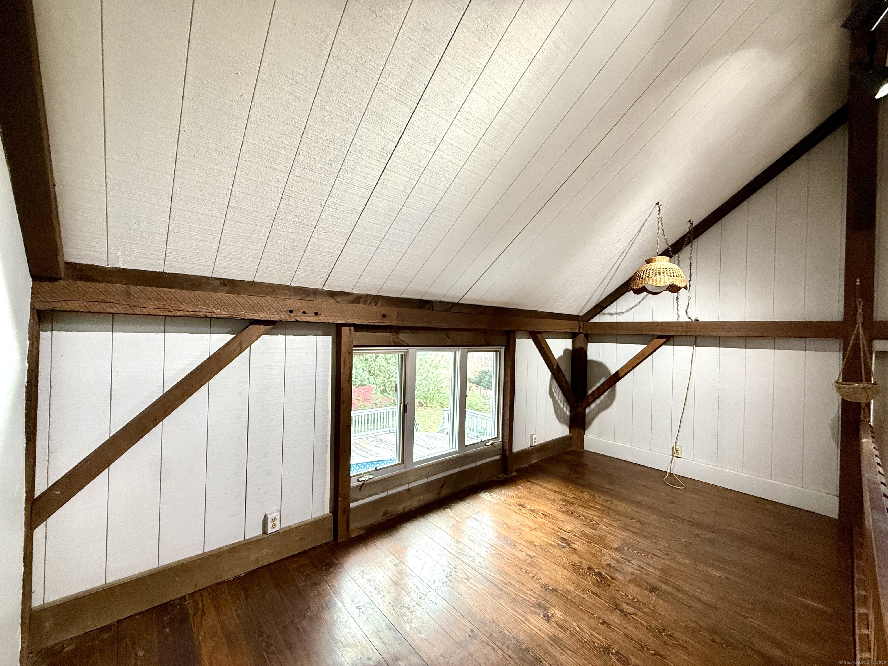 102 Krapf Road Ashford, CT 06278 - Photo 27 of 39 a view of an empty room with wooden floor and a window