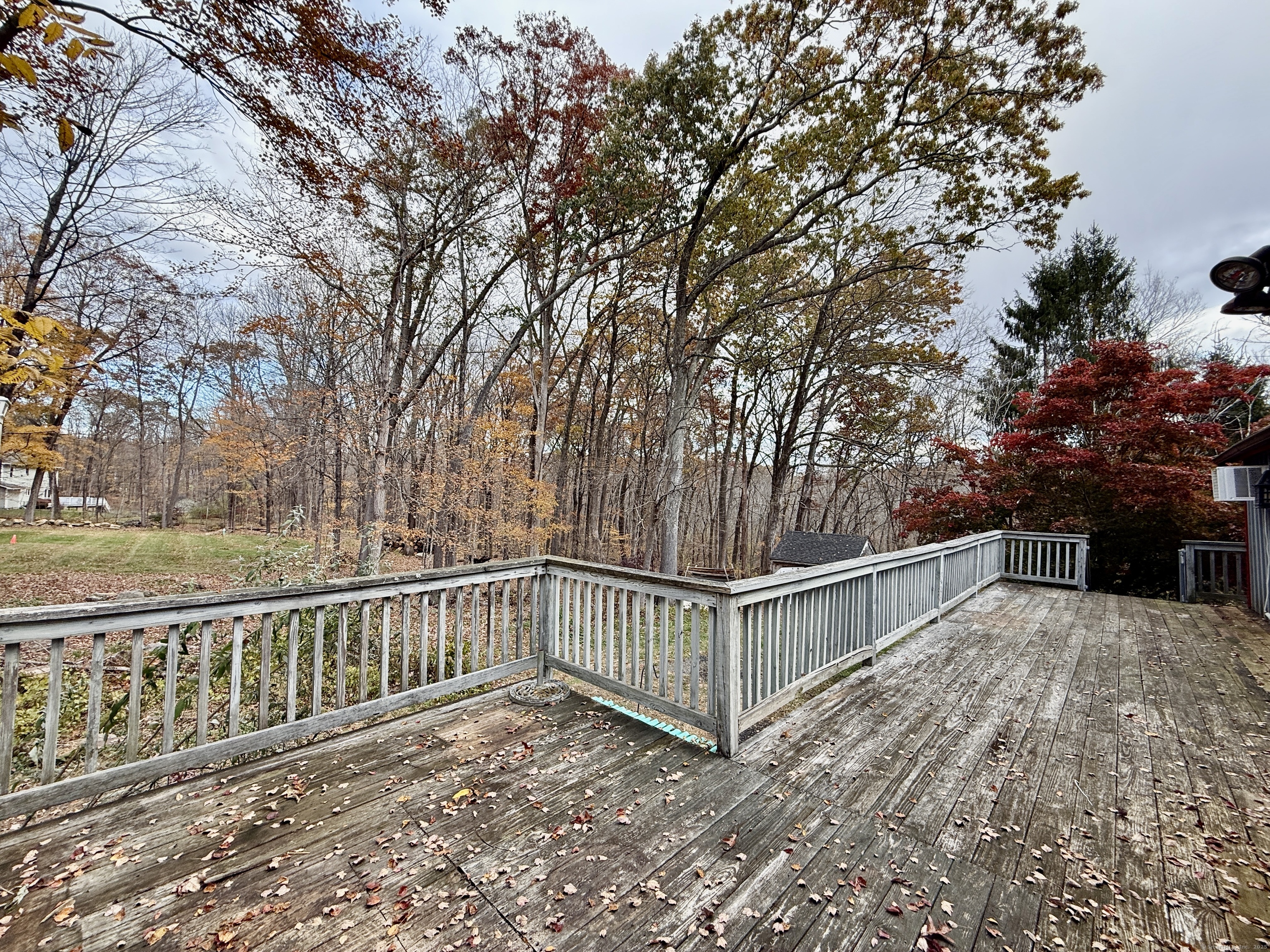 102 Krapf Road Ashford, CT 06278 - Photo 29 of 30 a view of a roof deck with wooden fence and large trees