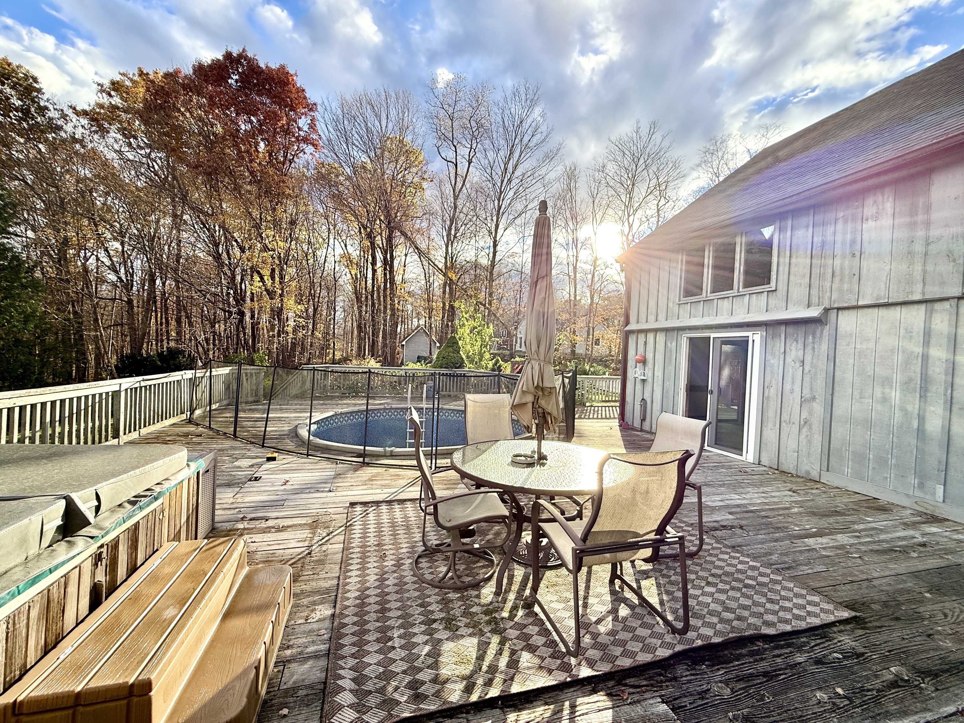 102 Krapf Road Ashford, CT 06278 - Photo 35 of 39 a view of a patio with a table and chairs and wooden fence