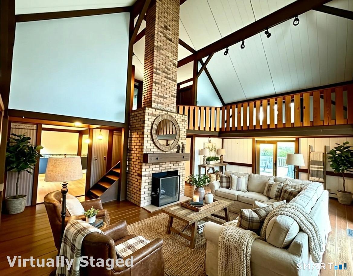 102 Krapf Road Ashford, CT 06278 - Photo 4 of 39 a living room with furniture a fireplace and a floor to ceiling window