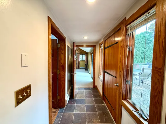 a bathroom with a toilet a sink and a mirror