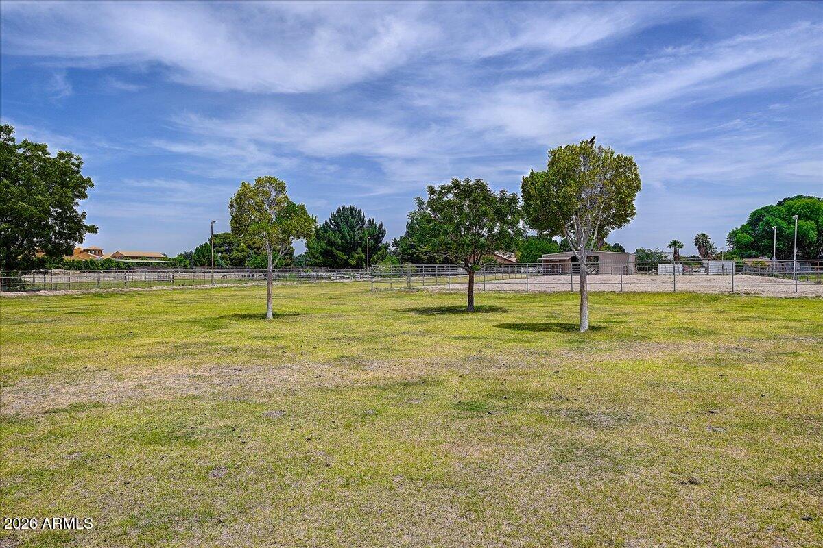 7624 North Citrus Road Waddell, AZ 85355 - Photo 45 of 57 a view of a swimming pool with a yard