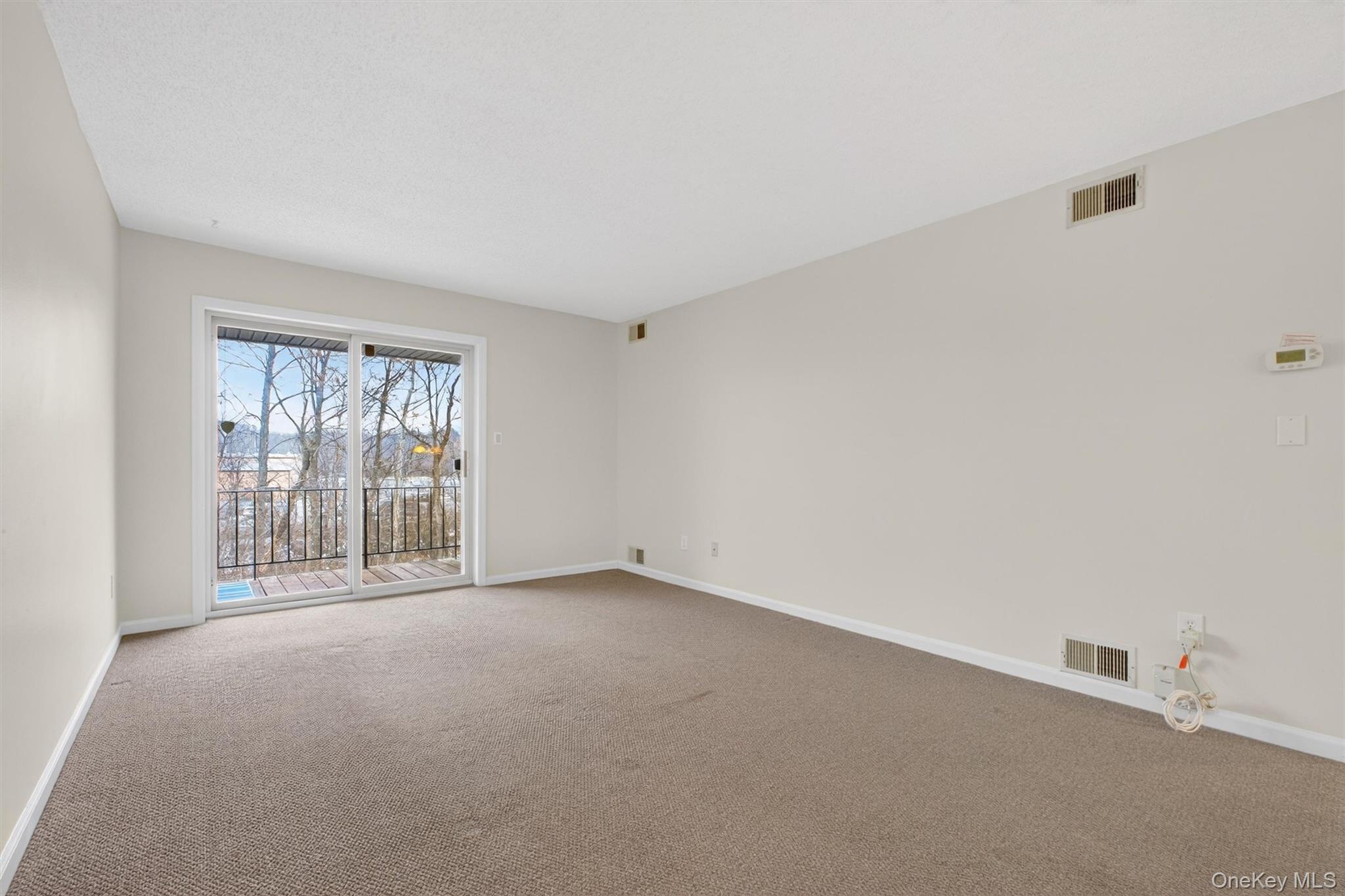 26 Cooper Road, Unit 715 Poughkeepsie, NY 12603 - Photo 12 of 30 Empty room featuring carpet flooring and baseboards