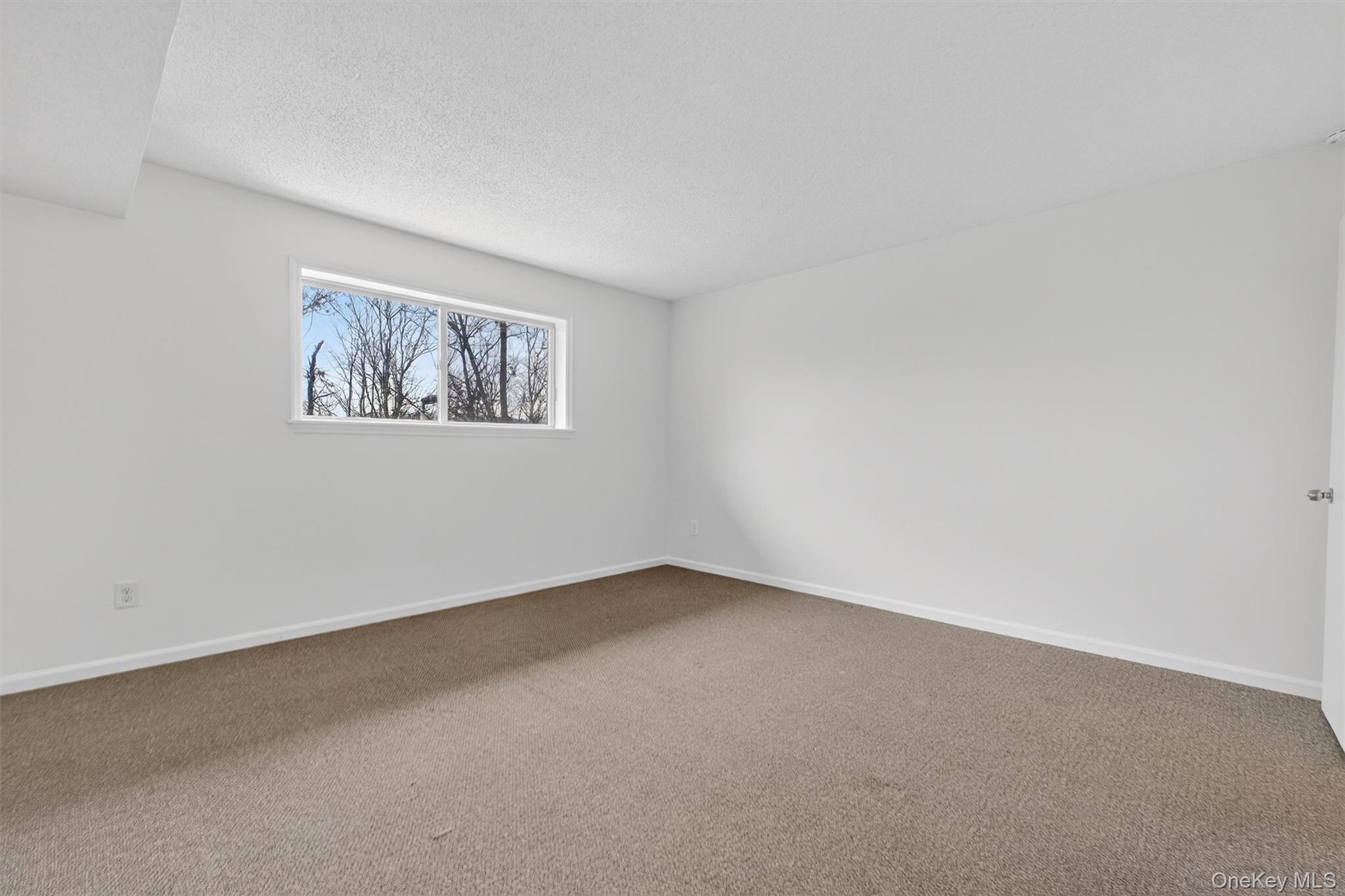 26 Cooper Road, Unit 715 Poughkeepsie, NY 12603 - Photo 18 of 28 an empty room with windows
