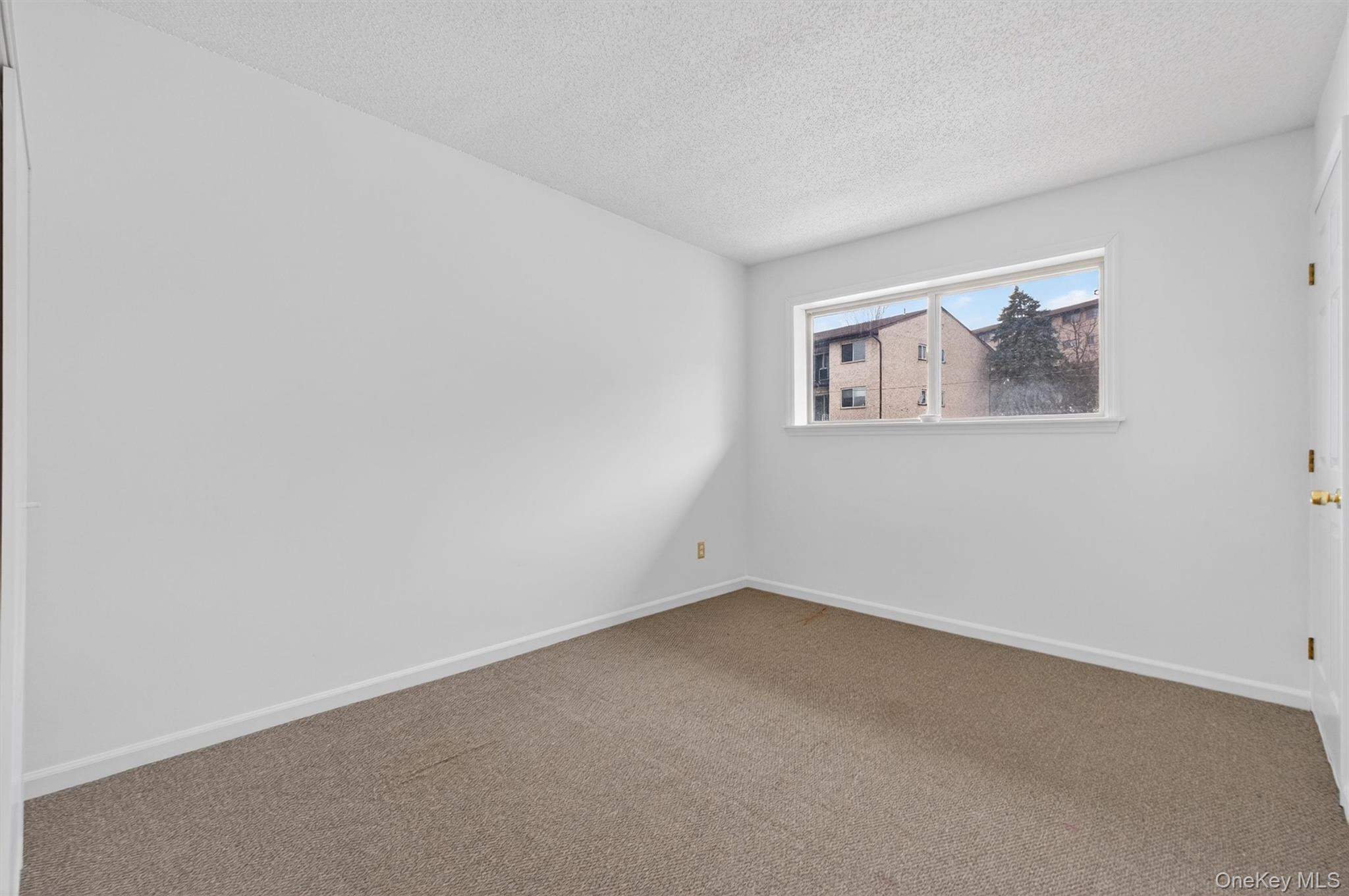 26 Cooper Road, Unit 715 Poughkeepsie, NY 12603 - Photo 22 of 28 an empty room with a window