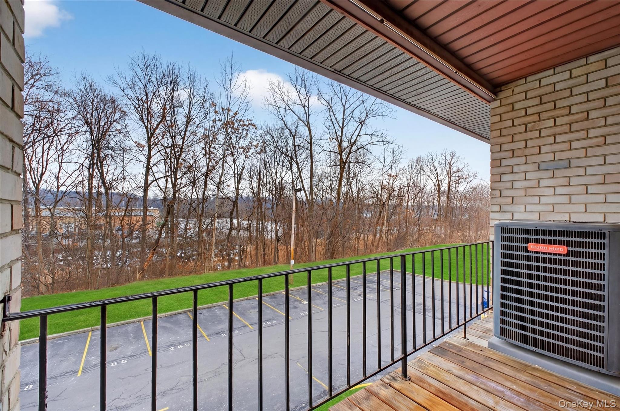 26 Cooper Road, Unit 715 Poughkeepsie, NY 12603 - Photo 24 of 28 a view of a backyard with a trees