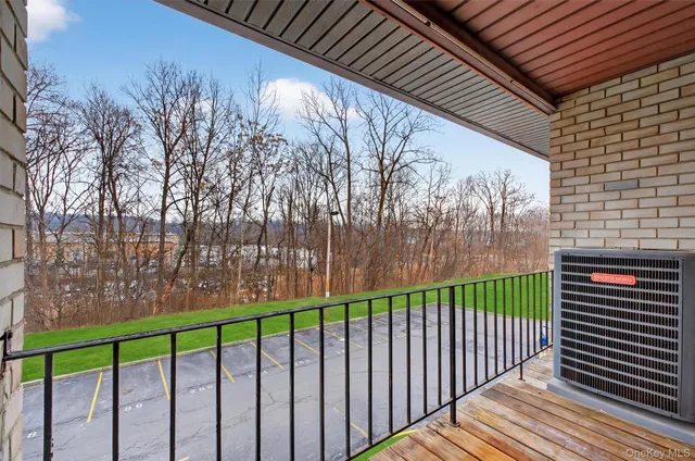 a view of a wooden fence from a balcony