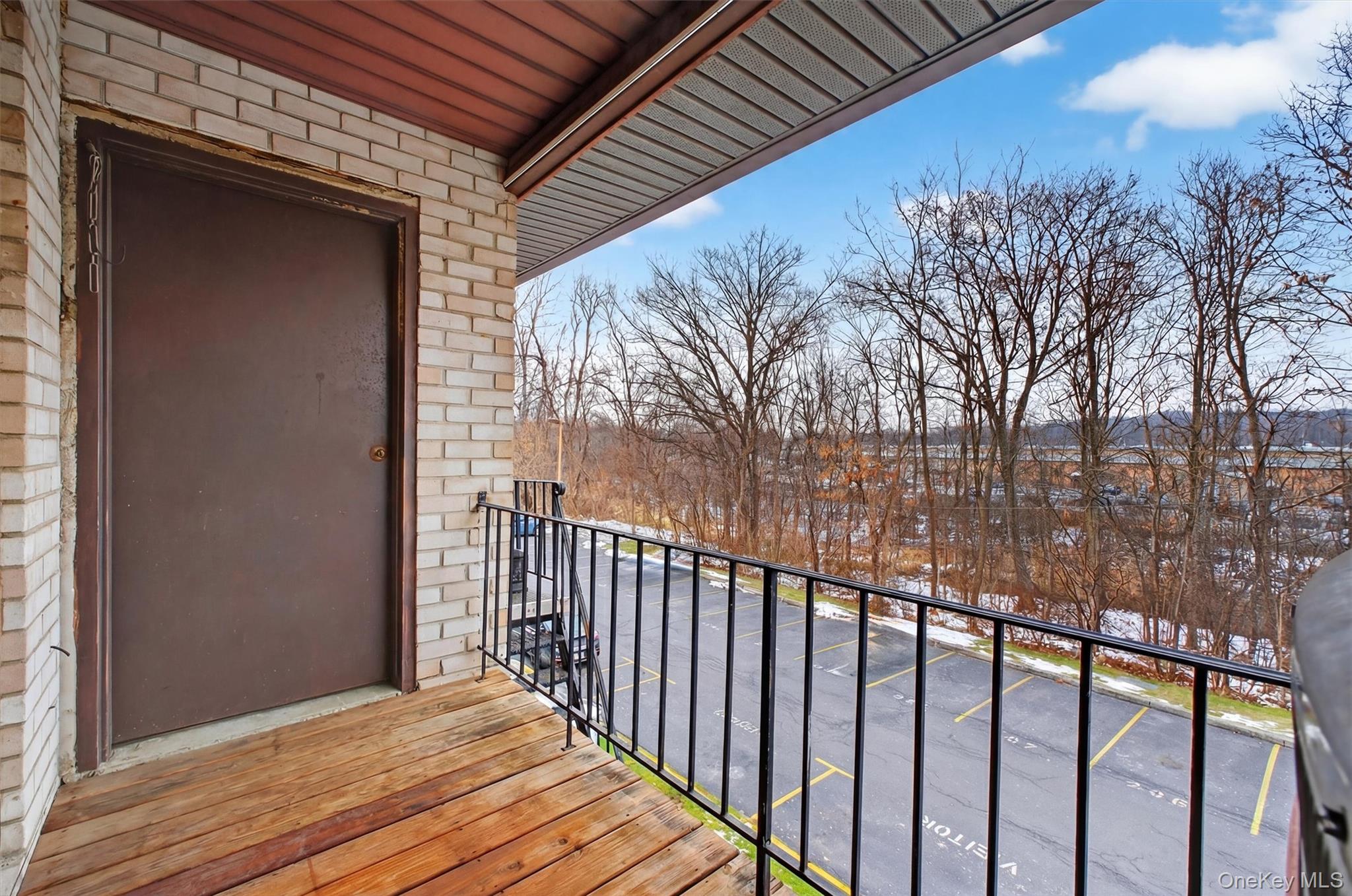 26 Cooper Road, Unit 715 Poughkeepsie, NY 12603 - Photo 26 of 30 a view of a wooden fence from a balcony