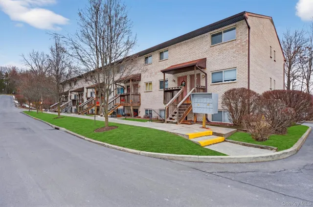 a view of a house with a yard porch and sitting area