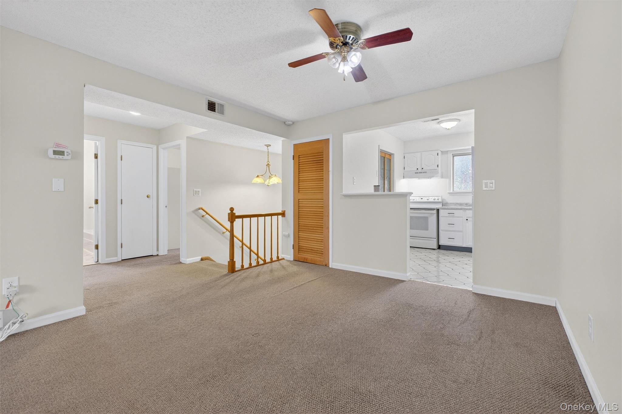 26 Cooper Road, Unit 715 Poughkeepsie, NY 12603 - Photo 8 of 30 a view of a livingroom with a ceiling fan