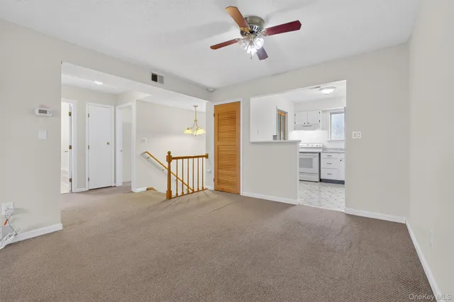 a view of a livingroom with a ceiling fan
