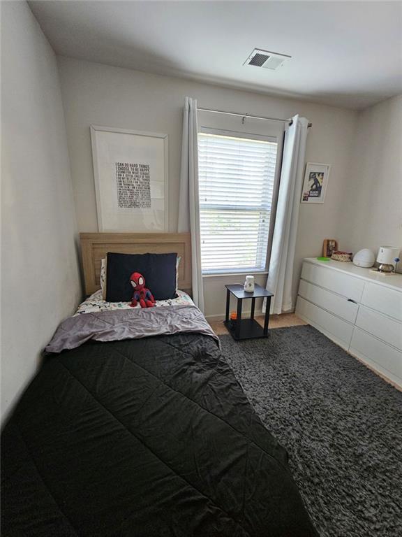 5747 Radford Loop Fairburn, GA 30213 - Photo 20 of 36 a bedroom with a bed and window