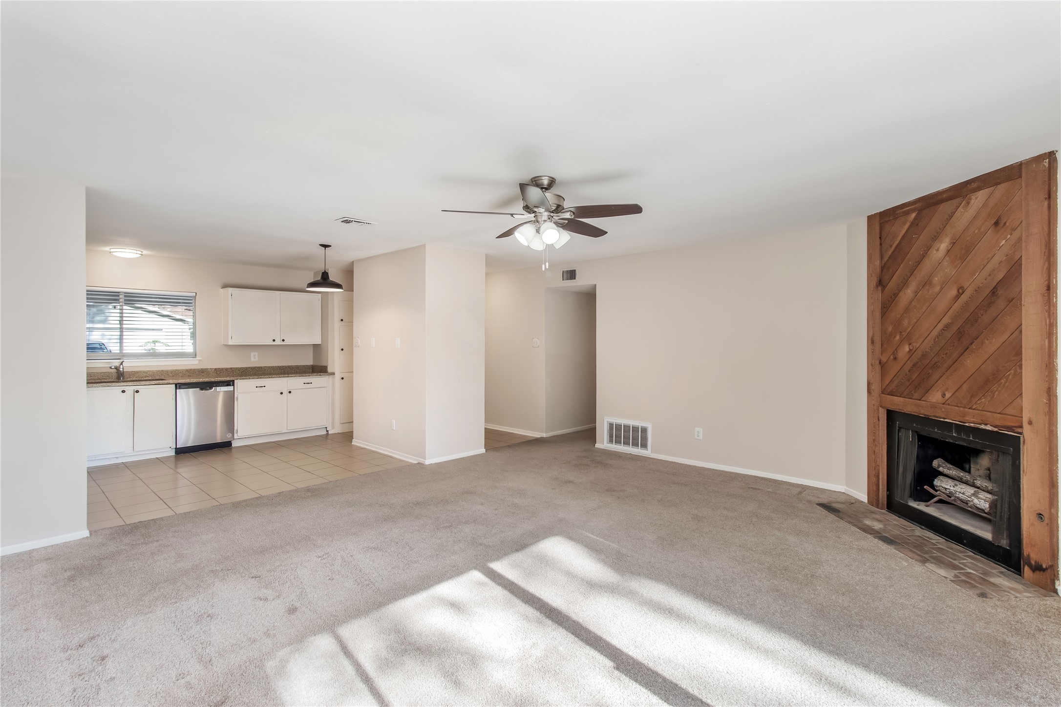 6 Red Deer Lane Spring, TX 77380 - Photo 11 of 24 a view of a kitchen with a sink and a fireplace