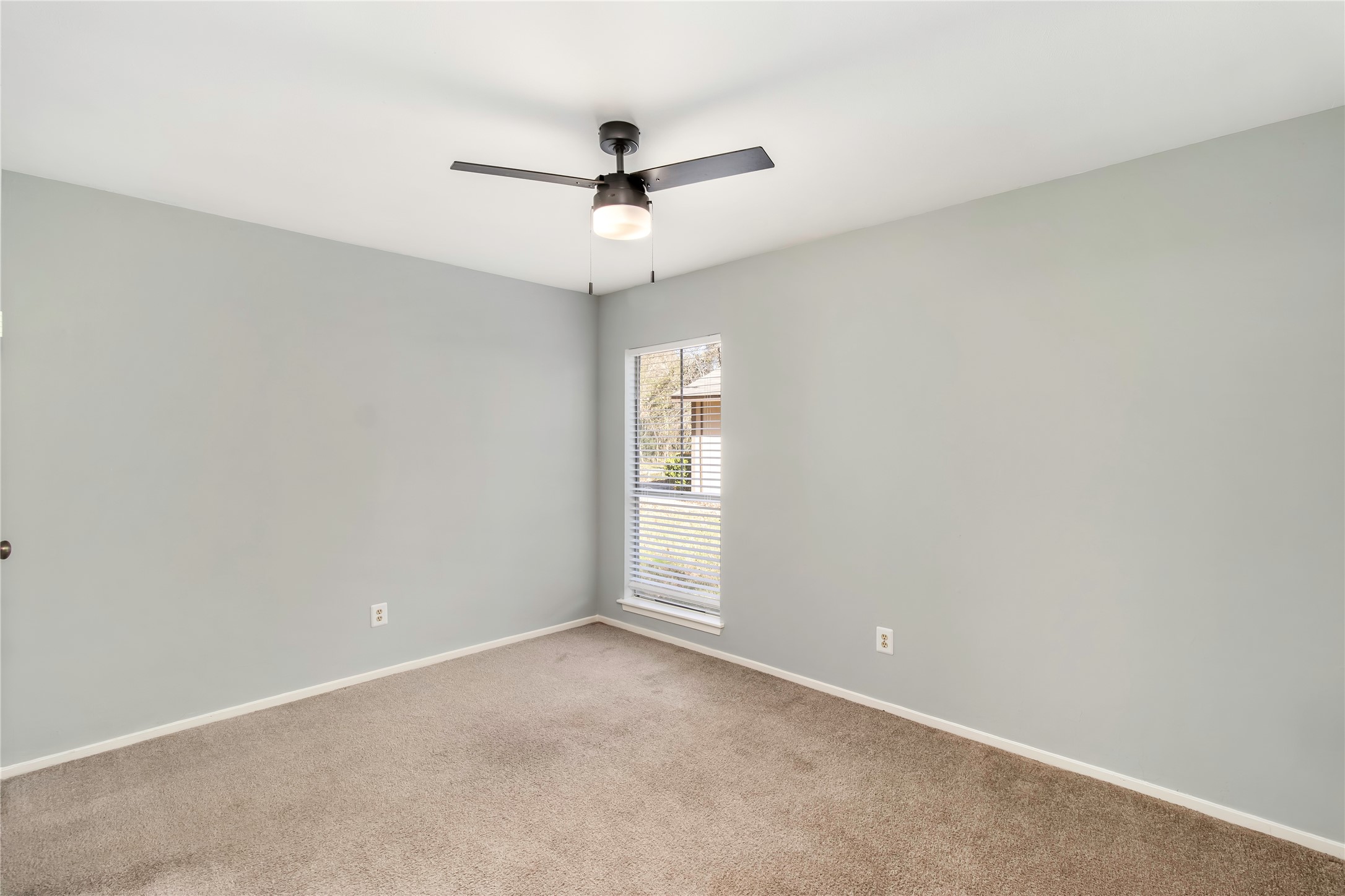 6 Red Deer Lane Spring, TX 77380 - Photo 18 of 24 an empty room with a window and a fan