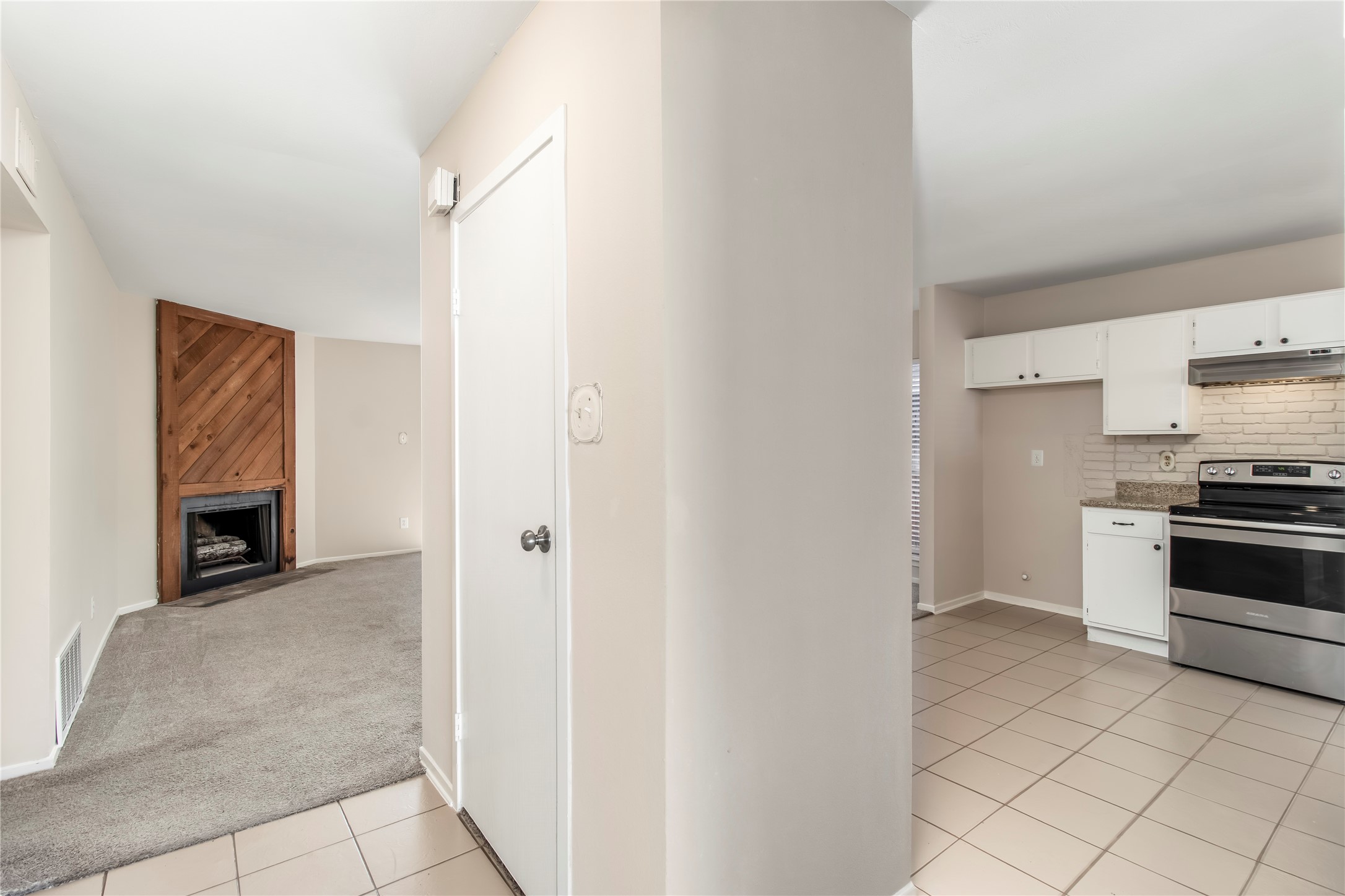 6 Red Deer Lane Spring, TX 77380 - Photo 6 of 24 a kitchen with granite countertop a stove and a refrigerator