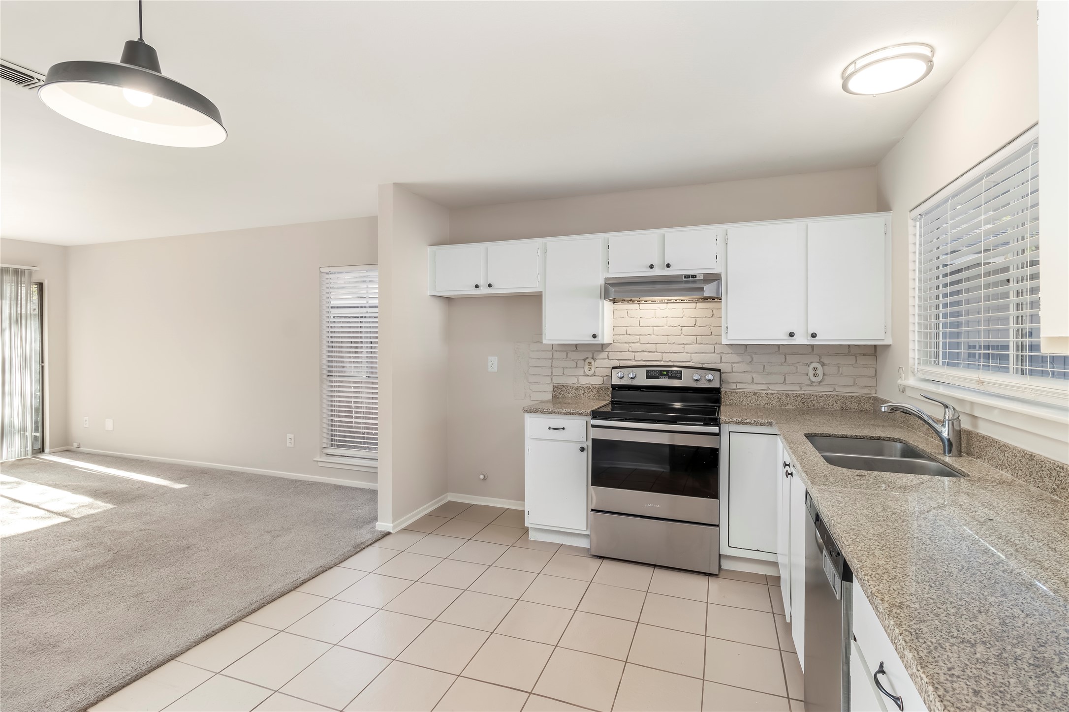 6 Red Deer Lane Spring, TX 77380 - Photo 7 of 24 a kitchen with a stove and a sink