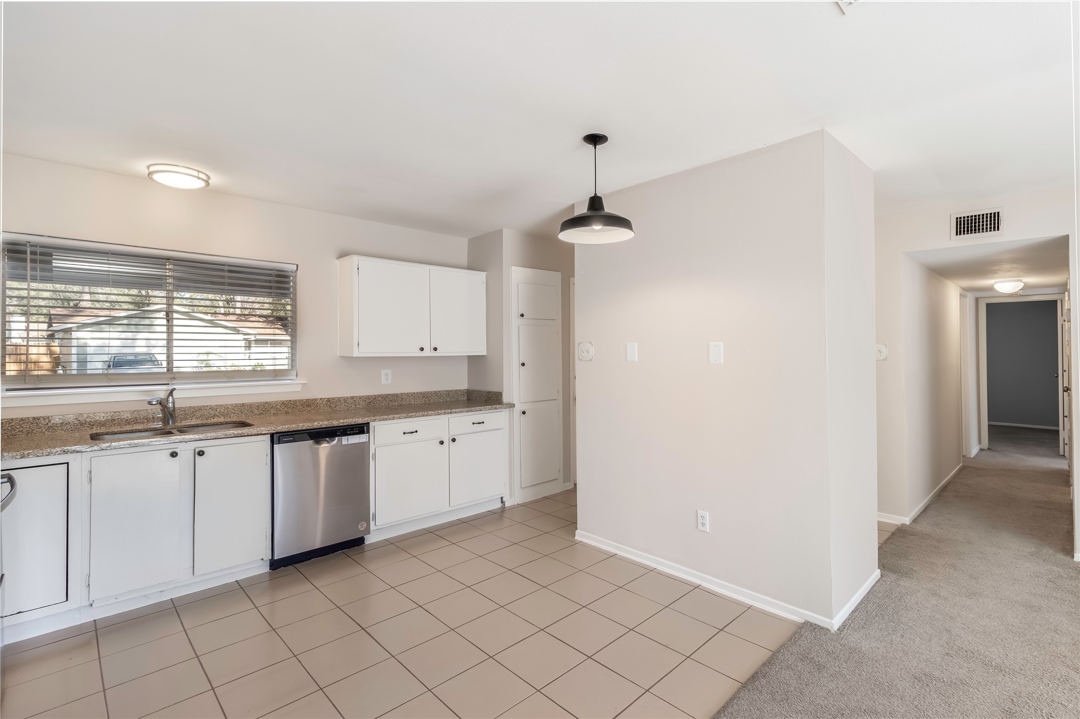 6 Red Deer Lane Spring, TX 77380 - Photo 9 of 24 a large white kitchen with a sink