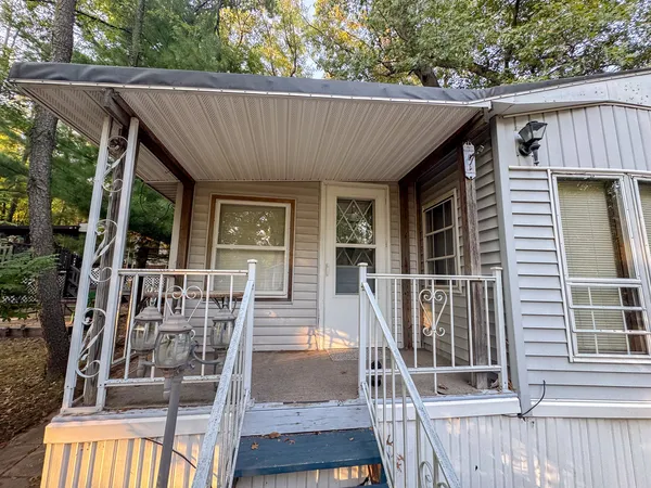 a view of house with outdoor seating space