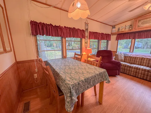 a outdoor sitting area with furniture and wooden floor