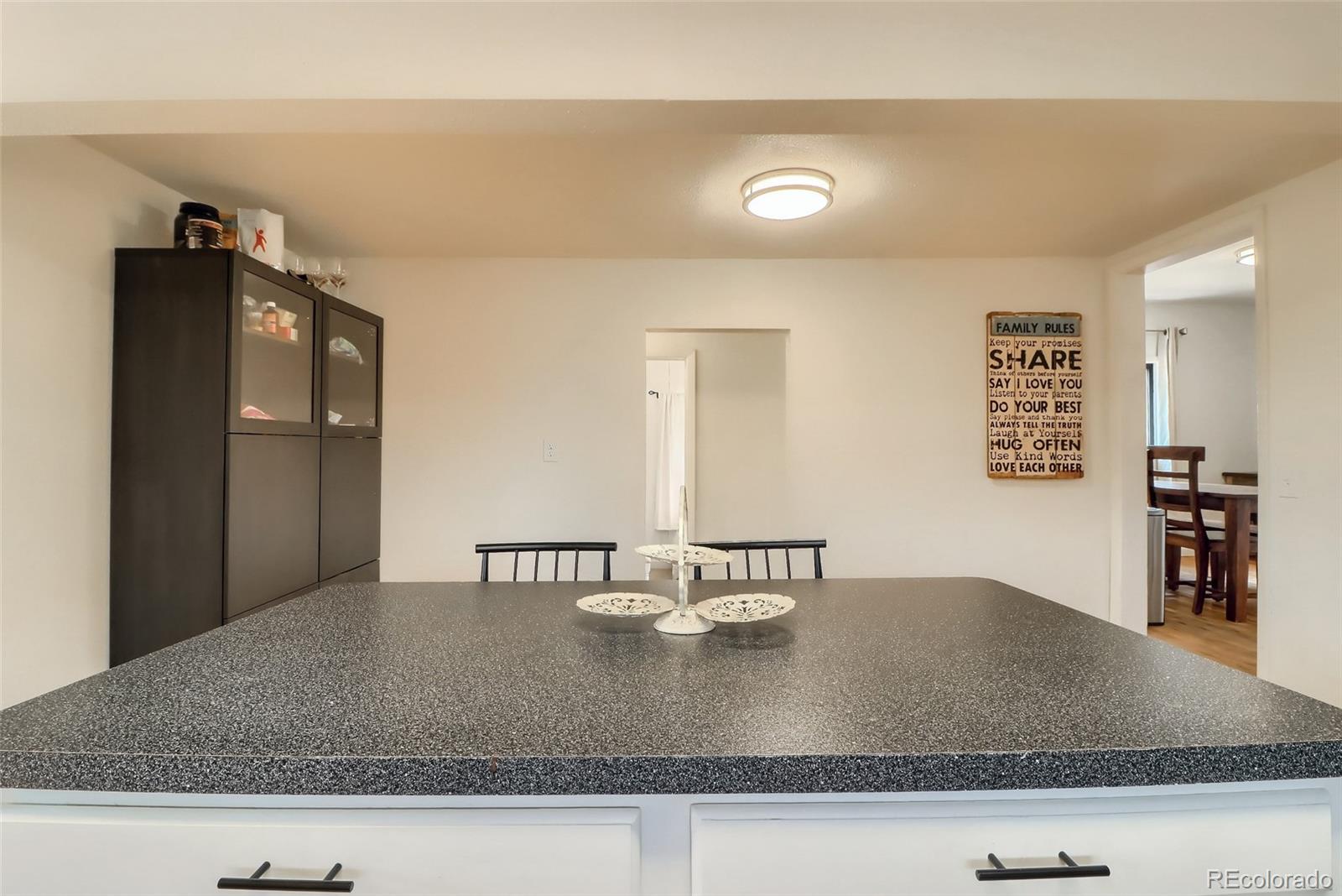 4175 West Custer Place Denver, CO 80219 - Photo 16 of 38 a view of a kitchen counter top space