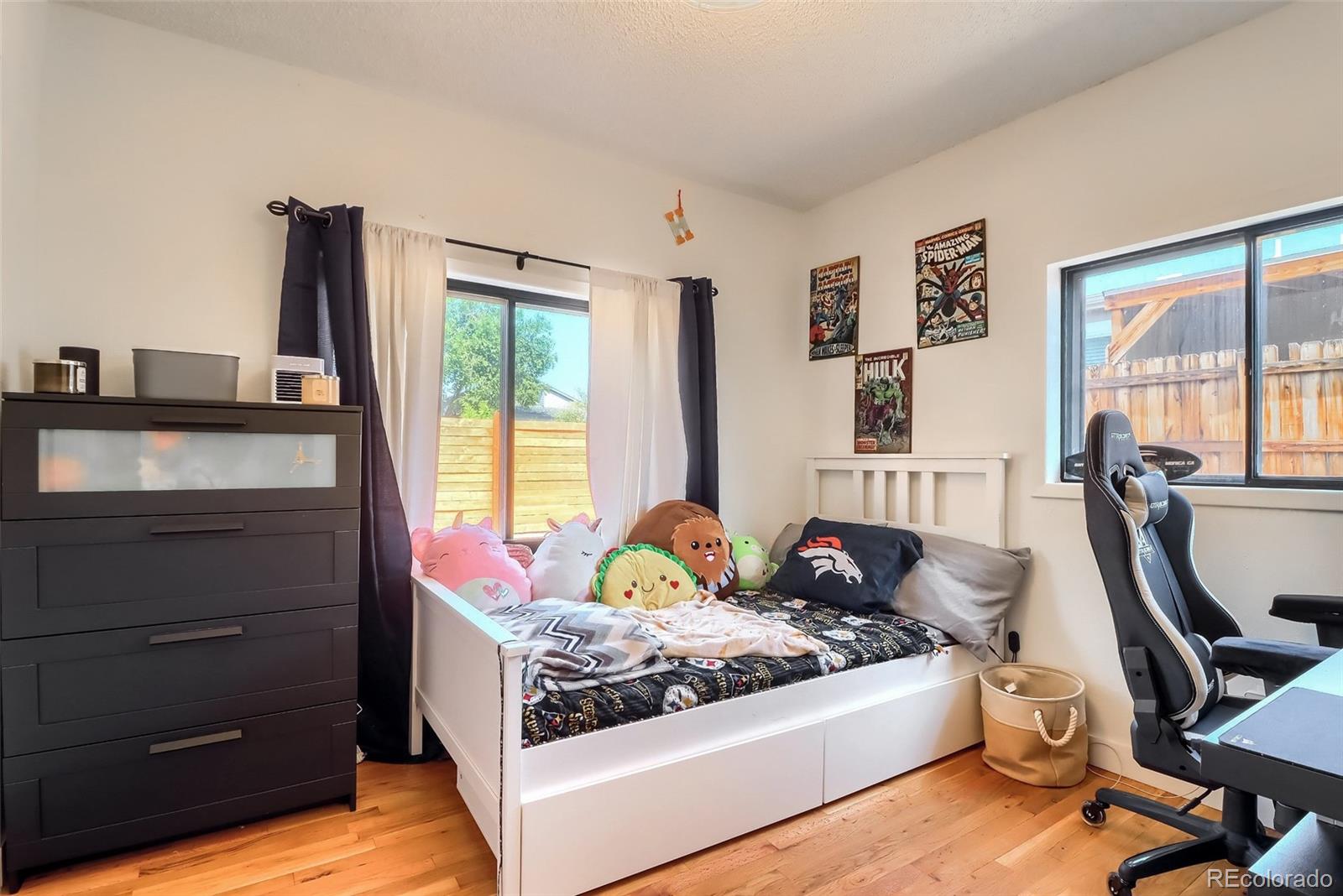 4175 West Custer Place Denver, CO 80219 - Photo 27 of 38 a bed room with furniture and a window