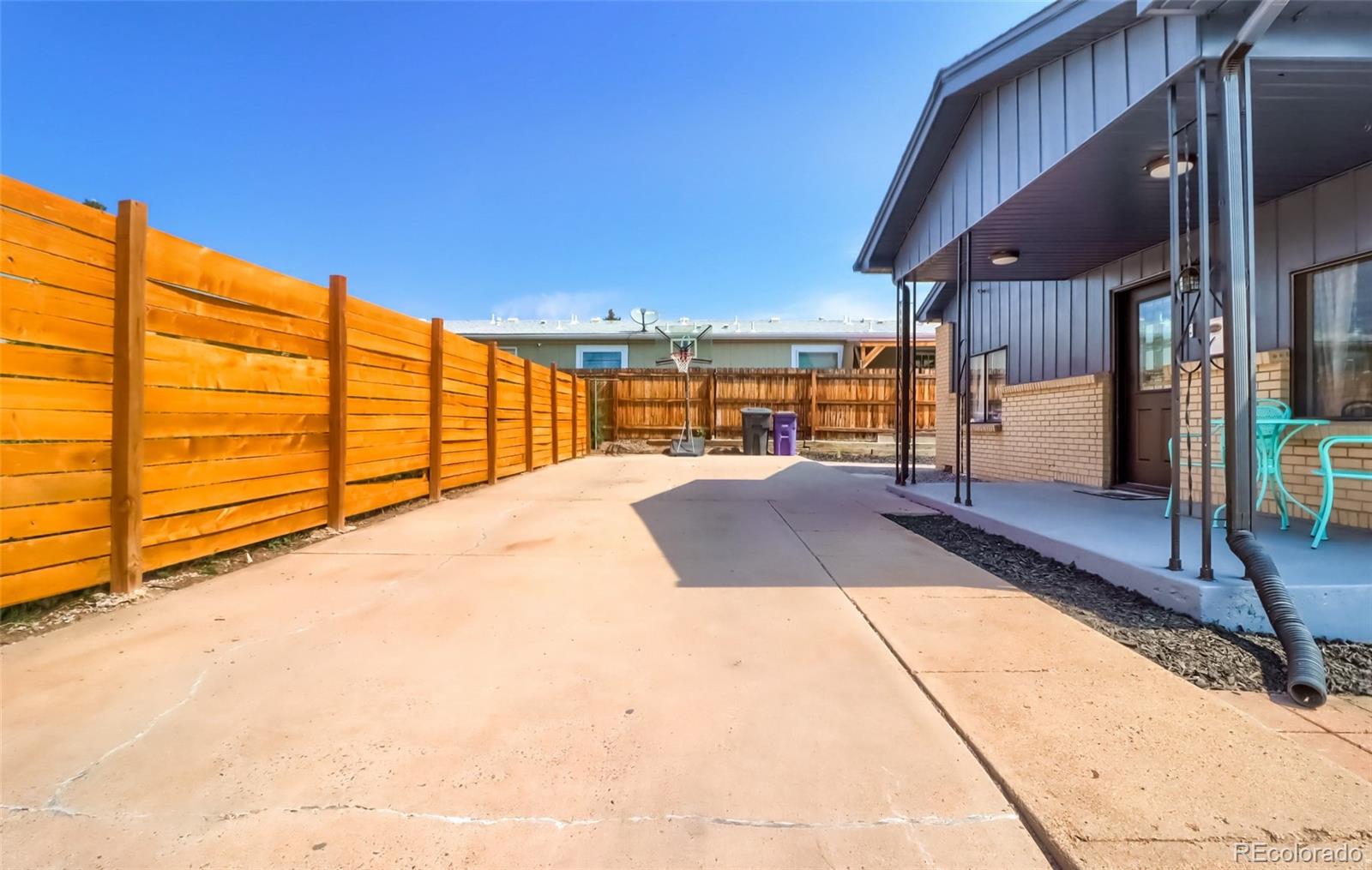 4175 West Custer Place Denver, CO 80219 - Photo 4 of 38 a view of a backyard with a patio