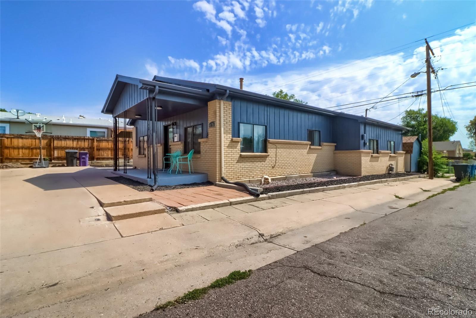 4175 West Custer Place Denver, CO 80219 - Photo 7 of 38 a house view with a outdoor space