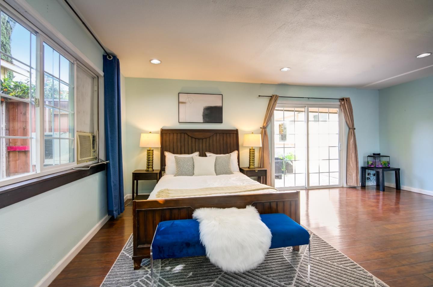 1224 Glacier Drive Milpitas, CA 95035 - Photo 18 of 45 a bedroom with a bed and wooden floor