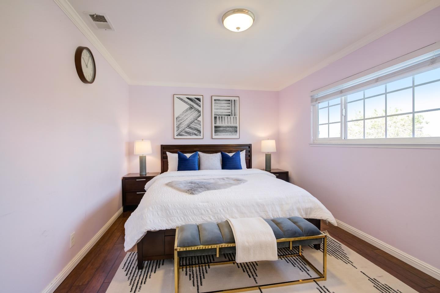 1224 Glacier Drive Milpitas, CA 95035 - Photo 19 of 45 a bedroom with a bed and a table