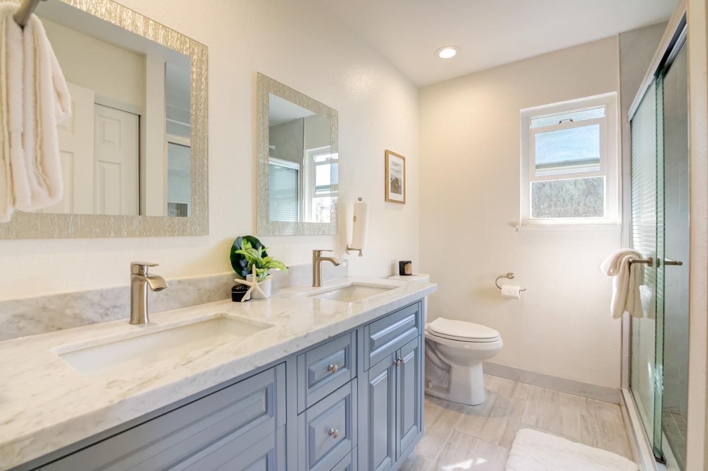 1224 Glacier Drive Milpitas, CA 95035 - Photo 21 of 45 a bathroom with a sink a toilet and a mirror