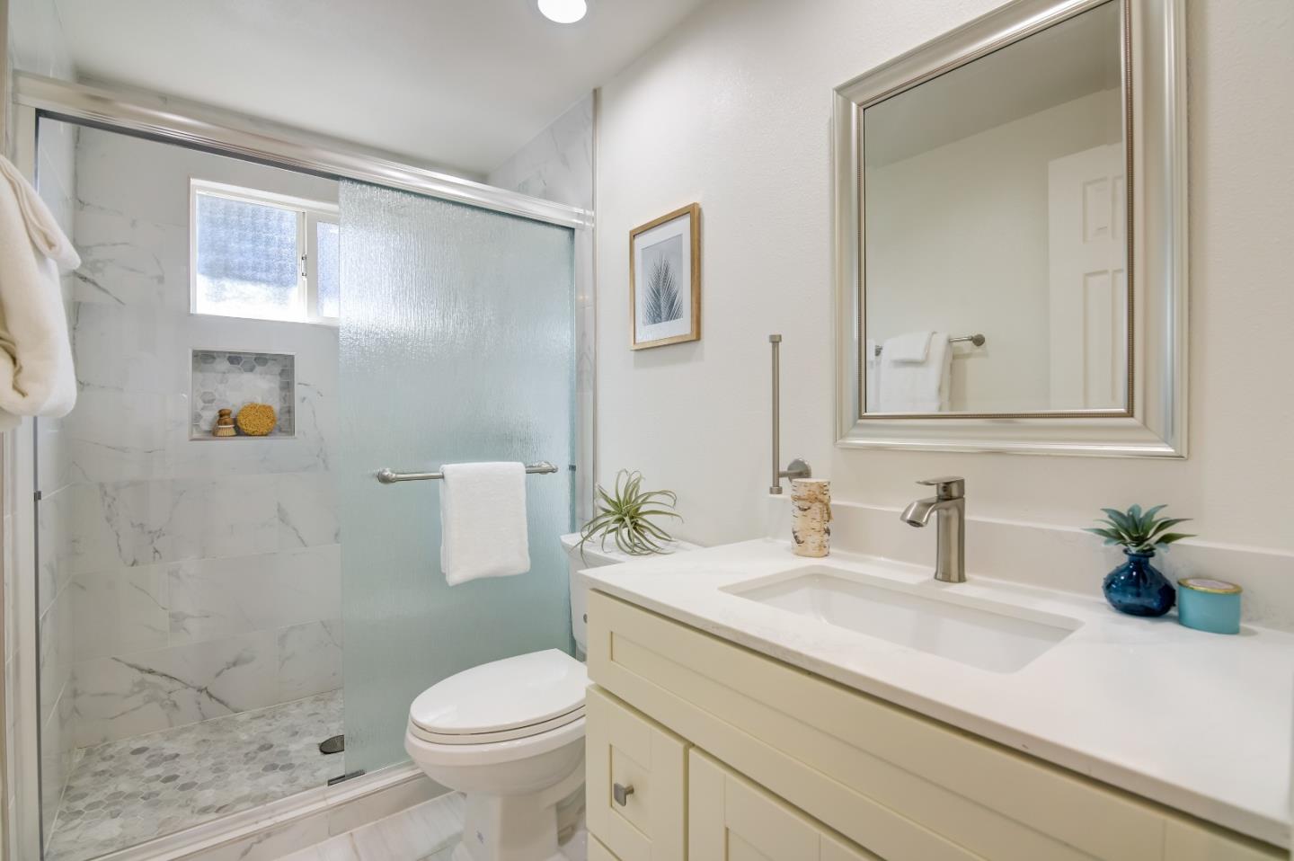 1224 Glacier Drive Milpitas, CA 95035 - Photo 22 of 45 a bathroom with a sink a toilet and a mirror