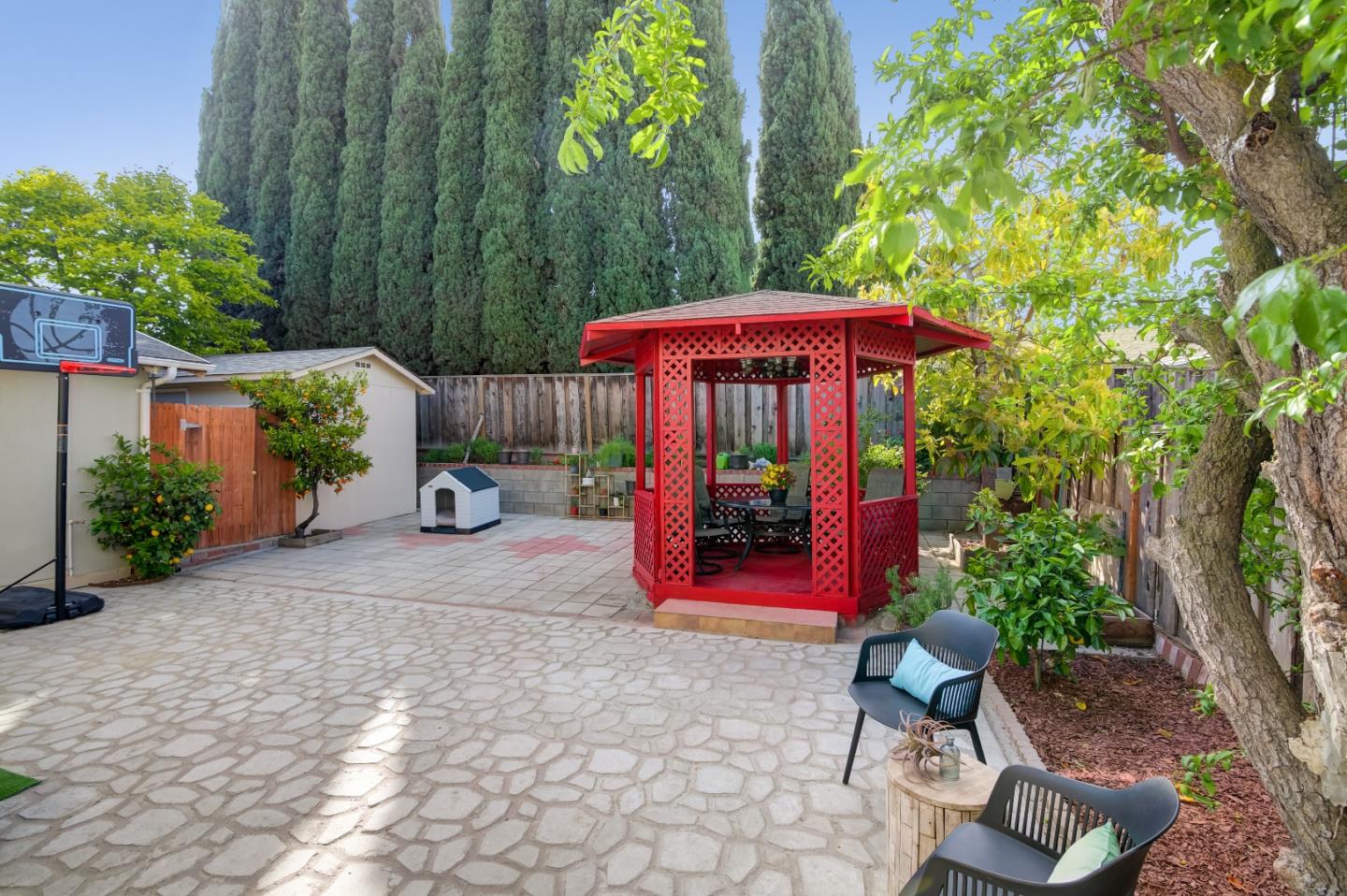 1224 Glacier Drive Milpitas, CA 95035 - Photo 29 of 45 a view of a patio with furniture and table under an umbrella