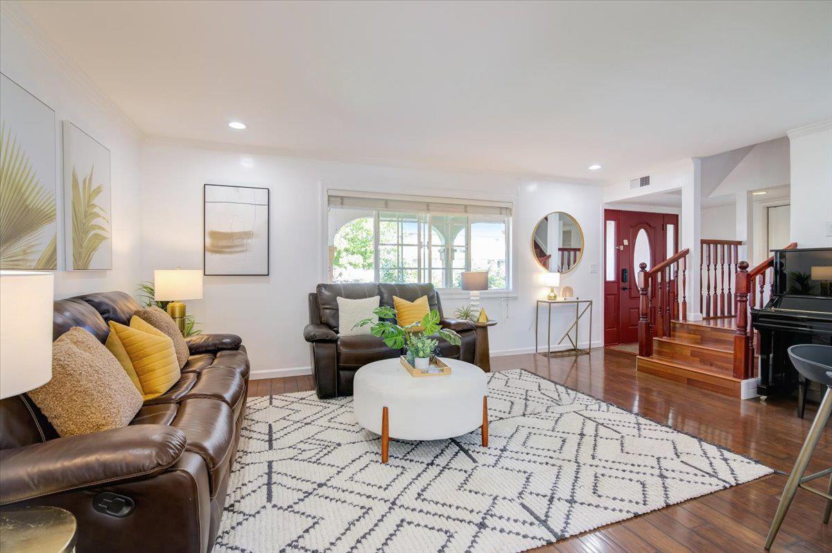 1224 Glacier Drive Milpitas, CA 95035 - Photo 3 of 45 a living room with furniture and wooden floor